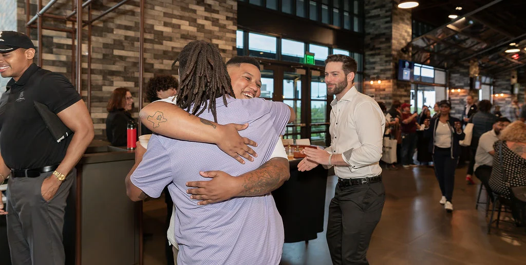 Masonwood team hugging.